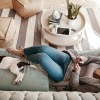 a woman and her dog on a couch