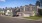 people standing in front of a home taking a photo